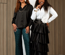 Curated elegance designed for the modern woman with a taste for luxury. Two models showcasing luxury formal wear including satin blouses and lace trousers by K&R Thread.